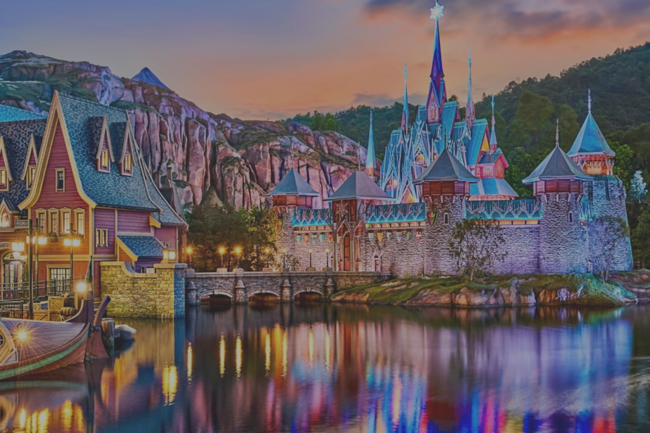 Elegant living room with a long cream sofa, gold accents, and a circular wall artwork above